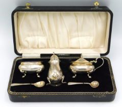 A cased 1956 Birmingham silver cruet set by Henry Clifford Davis, one later replacement spoon, 220mm