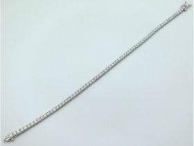 An 18ct gold diamond line bracelet of approx. 3ct,