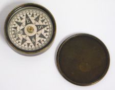 An early 20thC. brass pocket compass, 60mm diamete