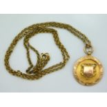 A 9ct gold 1920's sporting pendant inscribed to re