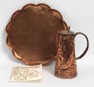 A Newlyn copper jug with lid by William Pezzack, 248mm tall, sold with Newlyn copper booklet twinned