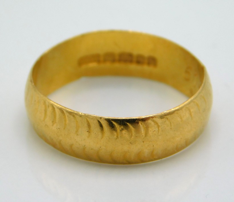 A 1960's 22ct gold band, 4.2g, size N/O