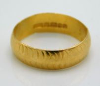 A 1960's 22ct gold band, 4.2g, size N/O