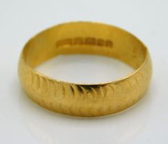 A 1960's 22ct gold band, 4.2g, size N/O