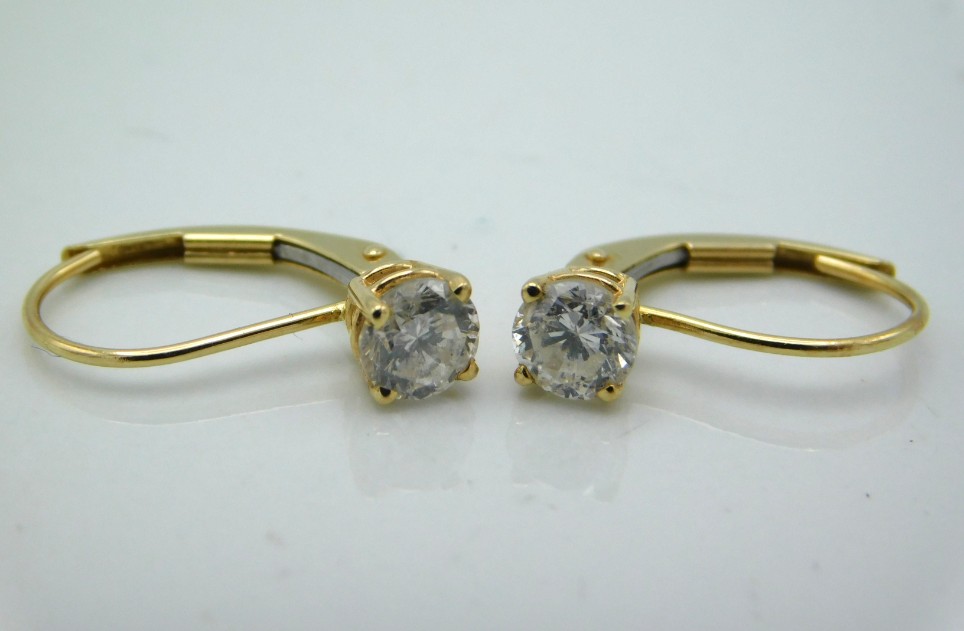 A pair of 14ct gold earrings set with diamonds, approx. 0.6ct total, 1g