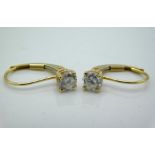 A pair of 14ct gold earrings set with diamonds, approx. 0.6ct total, 1g