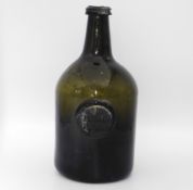 An 18thC. glass seal bottle, J. Braddon of Bridger