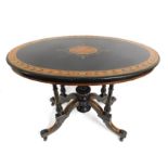 A Regency style table with lacquered decor, inlaid