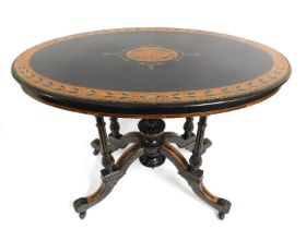 A Regency style table with lacquered decor, inlaid