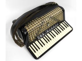 A full sized Hohner accordion with case