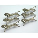 A novelty set of six silver plated knife rests as