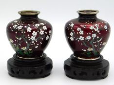 A pair of hand painted Japanese cloisonne vases wi