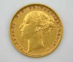An 1877 Victoria young head full gold sovereign, M