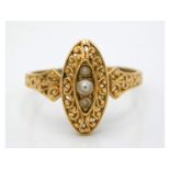 An antique yellow metal ring with carved decor, se