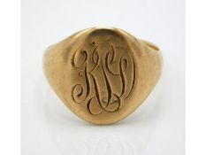 A antique yellow metal signet ring, monogrammed, t