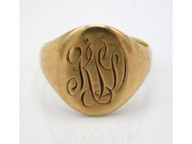 A antique yellow metal signet ring, monogrammed, t