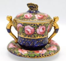 A c.1820 Spode chocolate cup & saucer decorated with roses & gilding on cobalt ground with butterfly