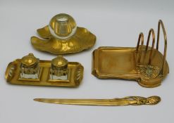 Four art nouveau brass desk items including a matc