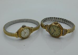 A ladies yellow metal cased Cirrus wristwatch twinned with one other yellow metal cased wristwatch,