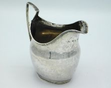 An 1800 George III London silver cream jug by William Hunter, 110mm tall, approx. 105g