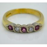 An 18ct gold pave set diamond & ruby ring with approx. 0.15ct of diamond, 4.9g, size N