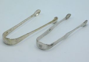 A pair of 1804 Georgian London silver sugar tongs by George Wintle twinned with a pair of 1802 Londo