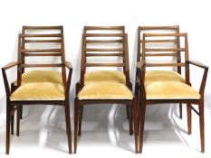 A Danish style teak dining suite comprising extending table, two carvers & four chairs, all of elega