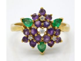 An 18ct gold cluster ring set with diamond, emeral