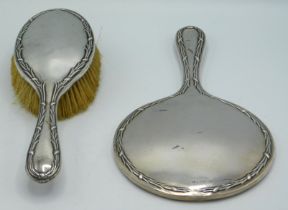 A 1919 Birmingham silver mounted mirror & brush by Martin Hall & Co. Ltd, mirror 280mm long