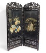 A decorative, carved Japanese hardwood screen with