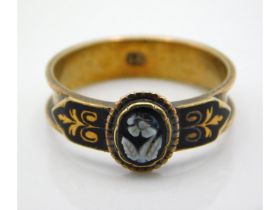 A 19thC. 15ct gold mourning ring with black enamel