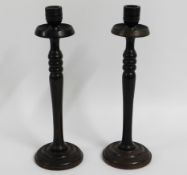 A pair of 19thC. turned rosewood candle holders, 3