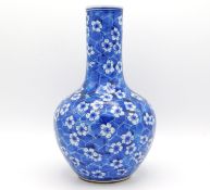 A 19thC. Chinese porcelain vase with prunus decor