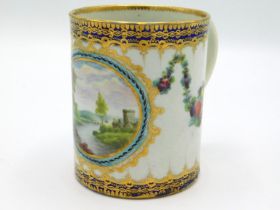 An 18thC. Worcester porcelain cup with landscape,