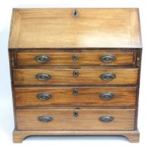 An early 19thC. mahogany bureau with brass fitting