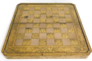 A 19thC. Chinese lacquer ware chess board with gil