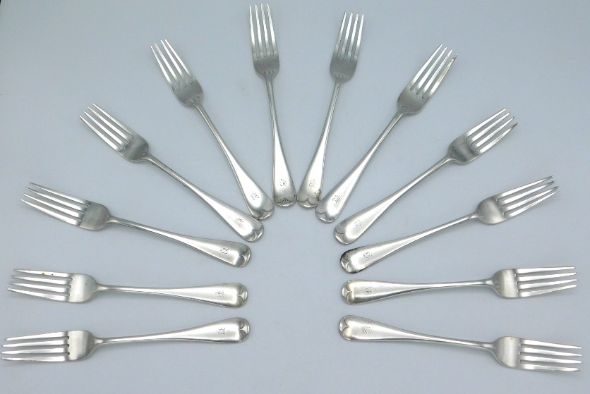 A matched set of twelve, eight 1903 Edwardian London silver dinner forks by Mappin Bros. one 1904 Ma