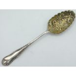 A 19thC. white metal berry spoon, tests as silver, 235mm long, approx. 85g
