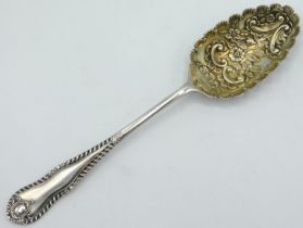 A 19thC. white metal berry spoon, tests as silver, 235mm long, approx. 85g