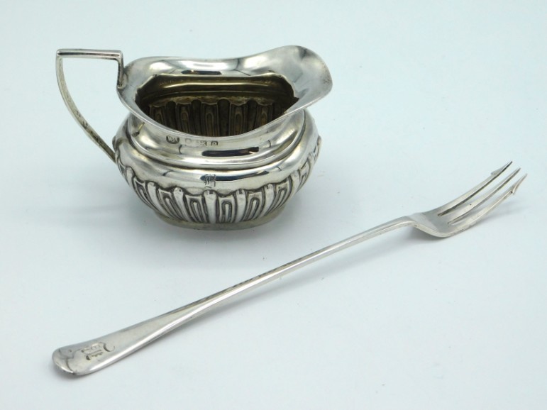 A 1904 Edwardian Birmingham silver creamer by William Aitken twinned with a 1903 Edwardian Sheffield