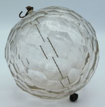 An early 20thC. faceted glass ball, believed to be
