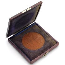 A cased Japanese bronze medallion commemorating 25