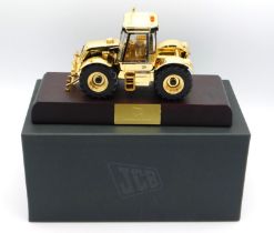A boxed Britains gold plated JCB 3185 Fastrac with