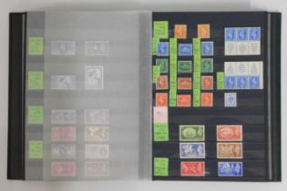 An album of mint GB stamps, 35 pages