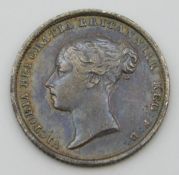 An 1842 Victoria silver bun head sixpence