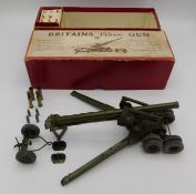 A boxed Britains 155mm Gun no.2064, some accessori