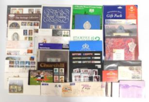 A quantity of 16 first day covers, 18 stamp packs, commemorative stamp books & other pieces includin