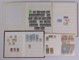 Three stamp albums of various world stamps includi