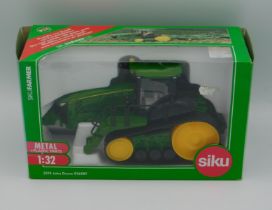 A boxed Siku 3274 John Deere 8360RT tractor, scale