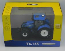 A boxed Universal Hobbies New Holland T5.165 tract
